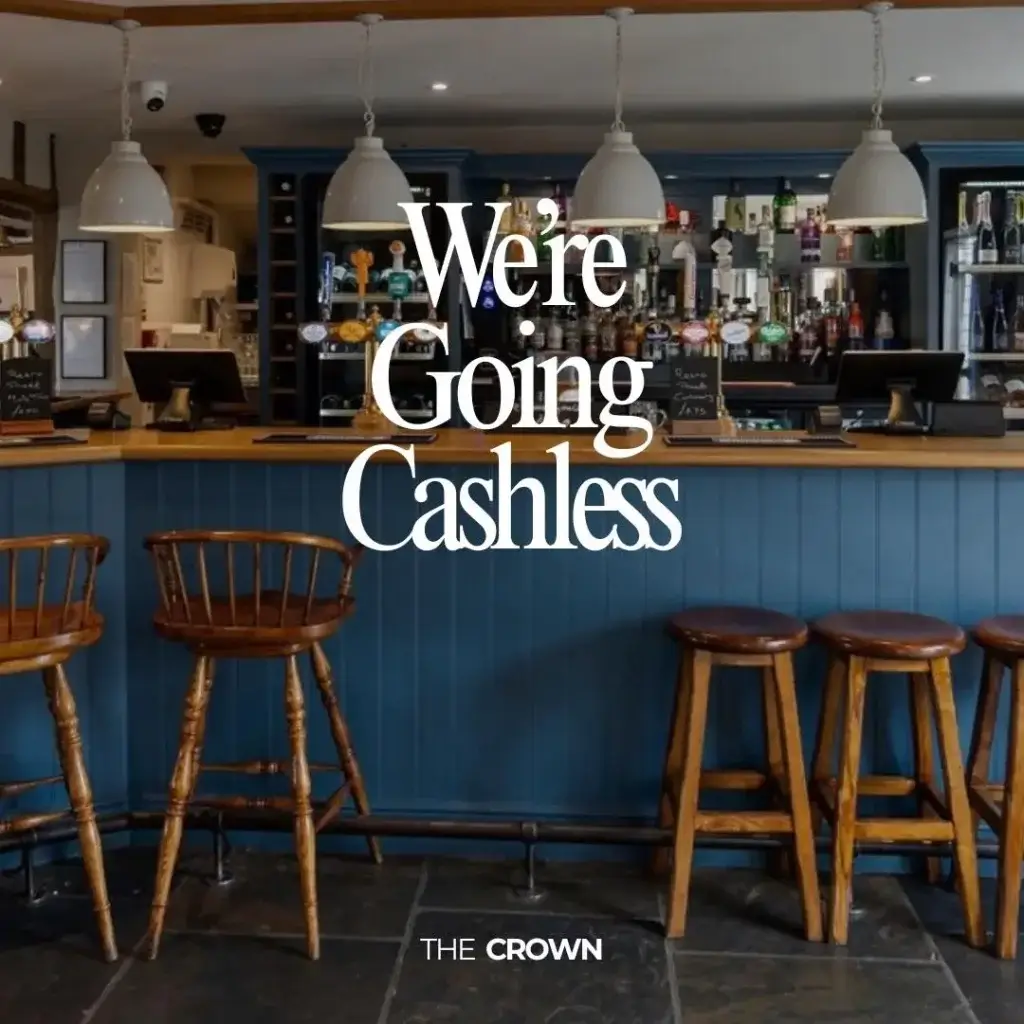 The Crown Stowupland bar area with stools and chairs sat along edge of the bar with the text - We're going cashless on top.